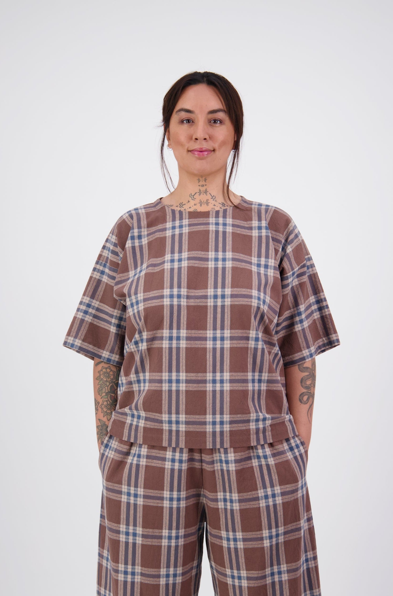 pacific island woman wearing two piece brown plaid cotton set