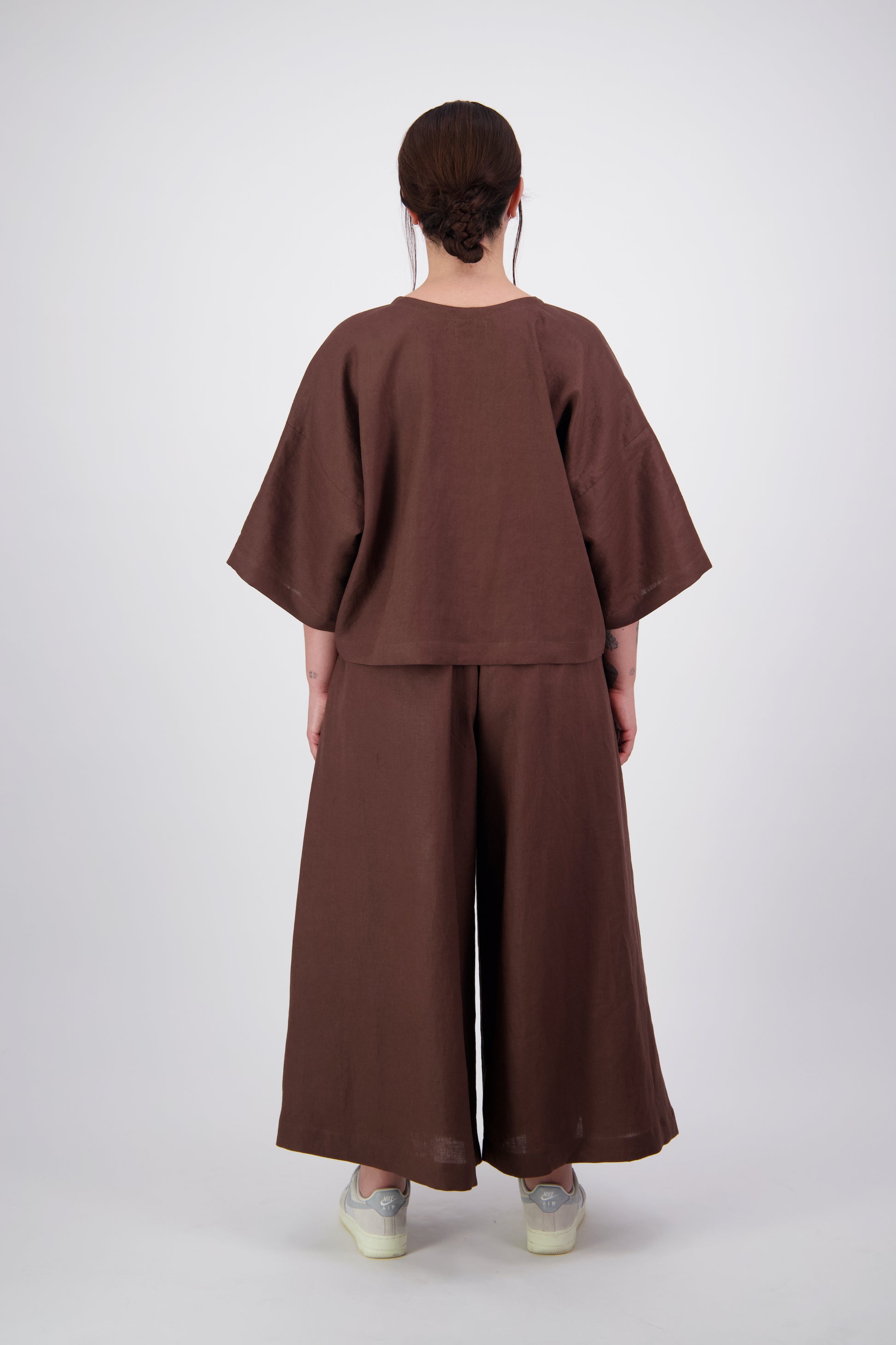 Woman wearing brown linen two piece loose fitting outfit made in new zealand